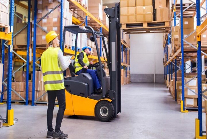 Warehouse professionals using material handling equipment safely